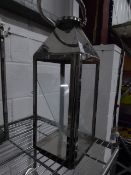 * S/S lantern. 180w x 180d x 510h. Missing 3 glass panels