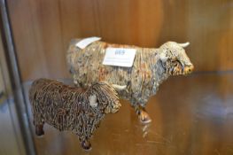 Two Signed Pottery Figures of Highland Cattle