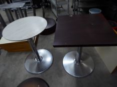 * 3 x tables with chrome bases - 2 x round (white wood effect top - 600d), 1 x square (dark work top