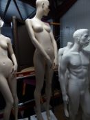 * peach female mannequin - attractive features - white/mirrored cube stand