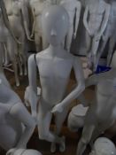 * white childs mannequin on glass stand