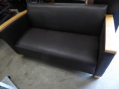 * Brown leather sofa with beech arms and feet. 1450w x 700d x 700h