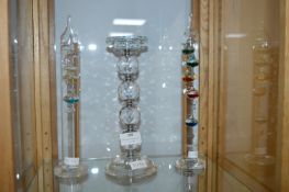 Two Glass Thermometers and a Candlestick