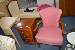 Red Upholstered Armchair and a Three Drawer Chest
