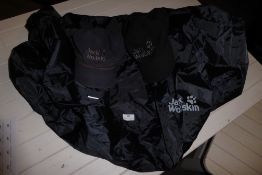 * 2 jack wolfskin hats and a jack wolfskin rucksack waterproof cover