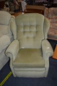 Green Upholstered Reclining Armchair