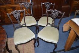 Four Carved Mahogany Dining Chairs