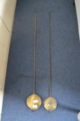 Two Long Case Clock Pendulums