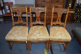 Three Victorian Carved Oak Dining Chairs on Casters