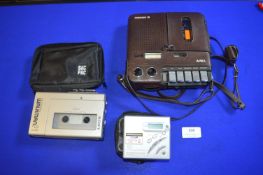 Sony Walkman F1, Sony Walkman MD, and an Aiwa Mimoec 12 Portable Cassette Player
