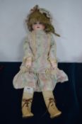 Bisque Headed Doll with Horse Shoe Logo in Original Kid Leather Legs and Boots