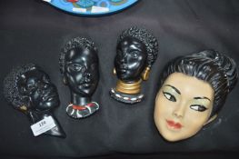 Four 1950's Plaster Ethnic Wall Faces