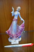 Art Deco Porcelain Figurine of a Dancer in a Blue & Red Dress
