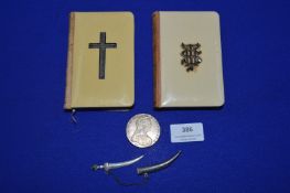 Two Bibles, Continental Silver Sword Brooch, and a Coin