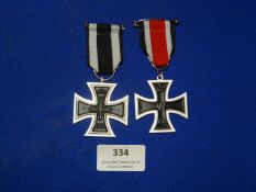 Two Reproduction WW1 Iron Crosses - One with WW2 Ribbon