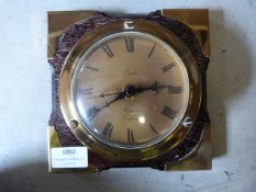 Brass Wall Clock Mounted on Oak with Brass Fittings