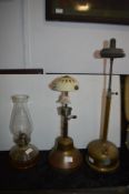 Two Brass Paraffin Lamps and a Glass Oil Lamp