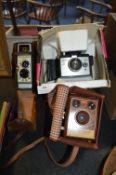 Polaroid Square Shooter 2 Land Camera, Brownie Flash B Box Camera and a Ben & Howell 8mm Cine Camera