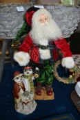 Father Christmas Figure and Christmas Meerkats