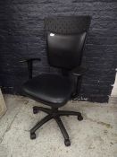 *black typist swivel chair with arms