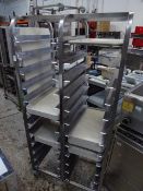 *stainless steel tray rack with space for 24 trays double with approximately 30 grey trays included