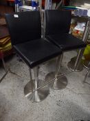 *pair of black gas lift beauticians chairs