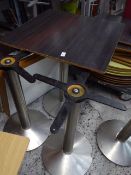 *4 dark wood effect topped dining tables on circular chrome base