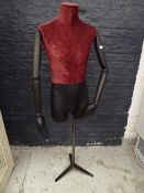 *male three-quarter mannequin with articulated arms on black stand red velvet body