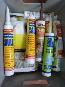 Box of Decorating Products Including Caulk, Frame