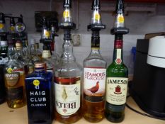 * ,4 bottles whiskey haig club nearly full ,bells 1\3, famous grouse half full , Jameson's 1\3
