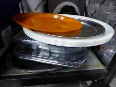 * quantity of large oval plastic trays and stainless steel platters approximately 17 items