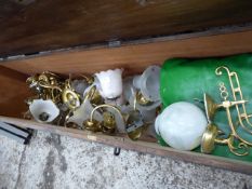 * contents of storage chest large quantity of brass light fittings with glass shades and spare