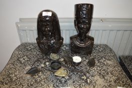 Two Black Egyptian Figures and a Candle Holder