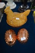 Two Copper Jelly Moulds and a Chicken