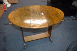Small 1930's Oval Oak Drop Leaf Occasional Table