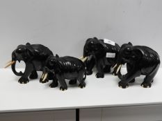 Four Carved African Elephants