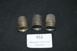 Two Silver Thimbles and One Other