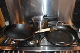 Pressure Cooker, Paella Skillet, and a Wok