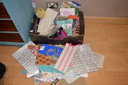 Box Containing Gift Bags, Gift Boxes, Part Popper, and Other Party Paraphernalia