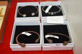 Four Copper Bracelets