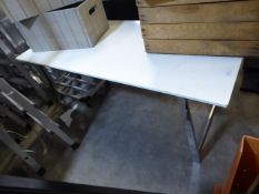 * low-level white display table on Chrome legs 1400 x 650 x570