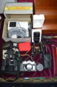Cameras, Binoculars, and a Vintage Firefly Lamp Pr