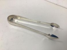 A pair of Scottish silver sugar tongs, early 19thc, maker's mark JW (32.22g)