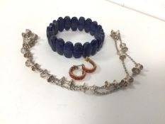 A collection of costume jewellery including a lapis lazuli bracelet (7cm), a pair of earrings with