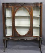 EDWARDIAN MAHOGANY DISPLAY CABINET with serpentine glass front panels flanking a cameo framed door