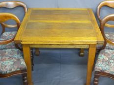 OAK DRAW-LEAF DINING TABLE and four mahogany balloon back dining chairs with upholstered drop-on