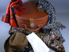 A VINTAGE LEATHER DRUM SHAPED SUITCASE initialled D E, quantity of furs ETC