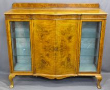 WALNUT 'SIDE BY SIDE' SERPENTINE FRONT DISPLAY CABINET, the central shaped doors opening to reveal