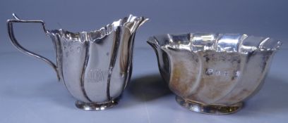 SILVER CREAM JUG & SUGAR BASIN of wavy panelled form with crimped rims, 7ozs, Dublin 1914, each