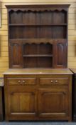SMALL ANTIQUE OAK DRESSER, boarded rack with small cupboards, on a base fitted with two frieze